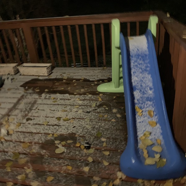 Image of a deck with light snowfall.