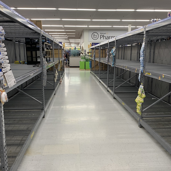 Empty paper goods aisle of Walmart.